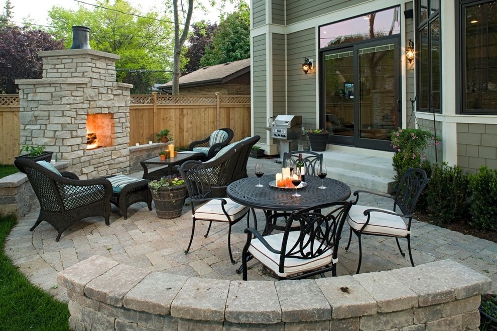 Design ideas for a medium sized classic back patio in Chicago with a fire feature, brick paving and no cover.