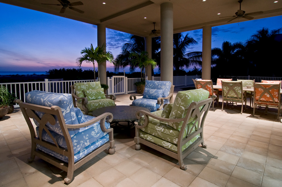 Inspiration for a coastal backyard tile patio remodel in Miami with a roof extension