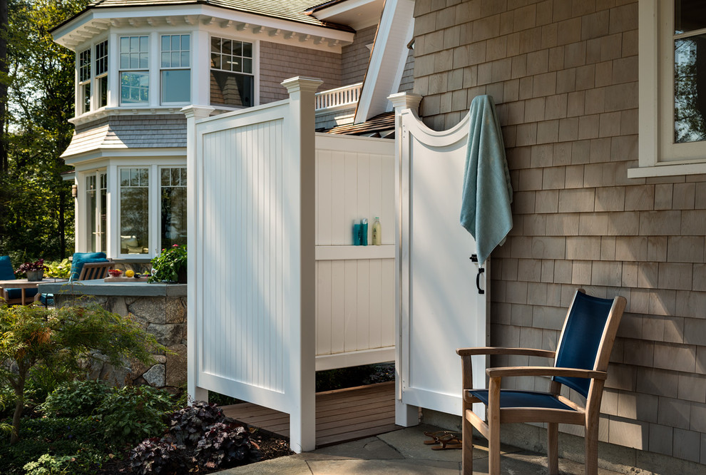 Outdoor patio shower - large coastal backyard stone outdoor patio shower idea in Boston with no cover