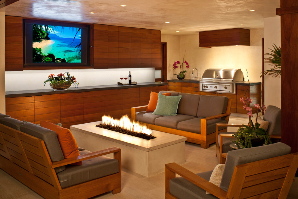 Inspiration for a contemporary tile patio remodel in Los Angeles with a roof extension