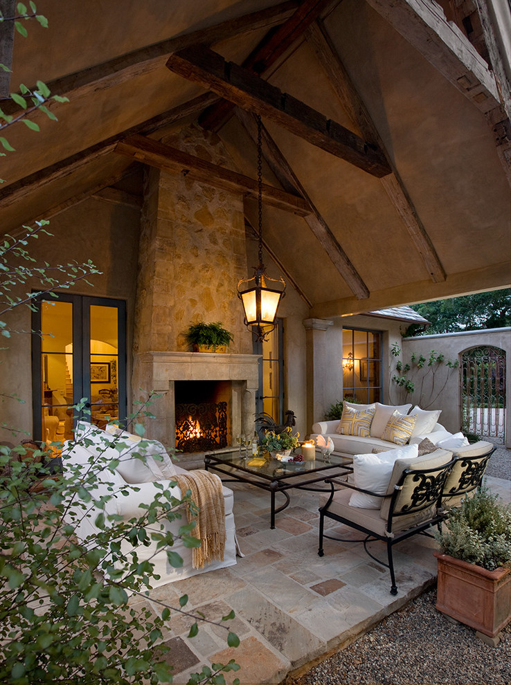 Inspiration for a mediterranean patio remodel in Santa Barbara with a fire pit