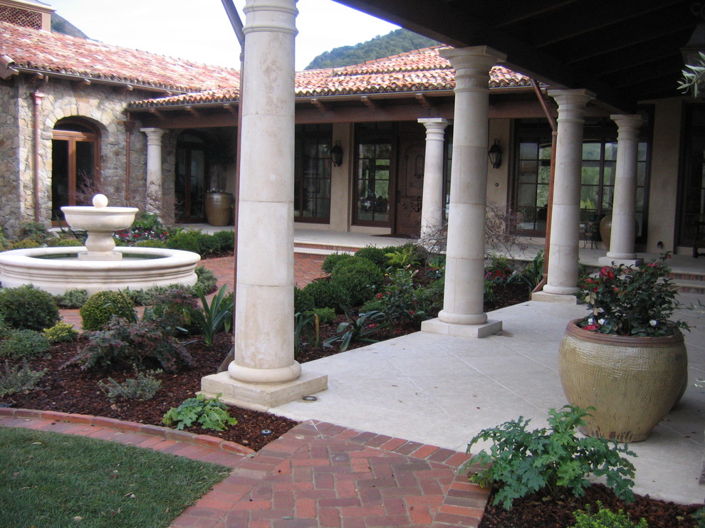 Example of a tuscan patio design in Dallas