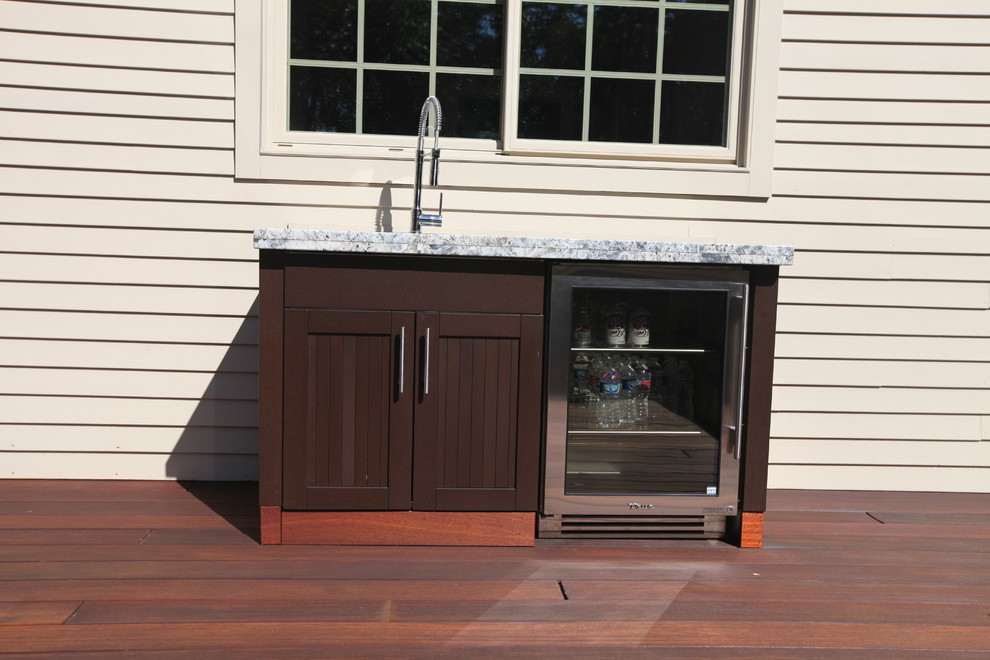 Example of a mid-sized transitional backyard patio kitchen design in Bridgeport with decking and no cover