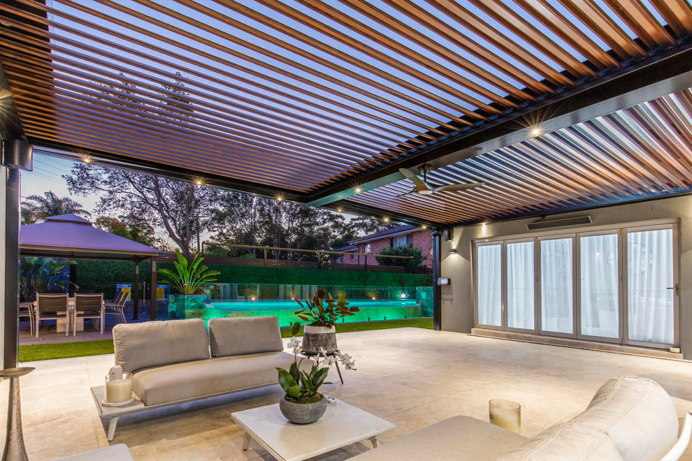 Design ideas for an expansive contemporary back patio in Sydney with an outdoor kitchen.
