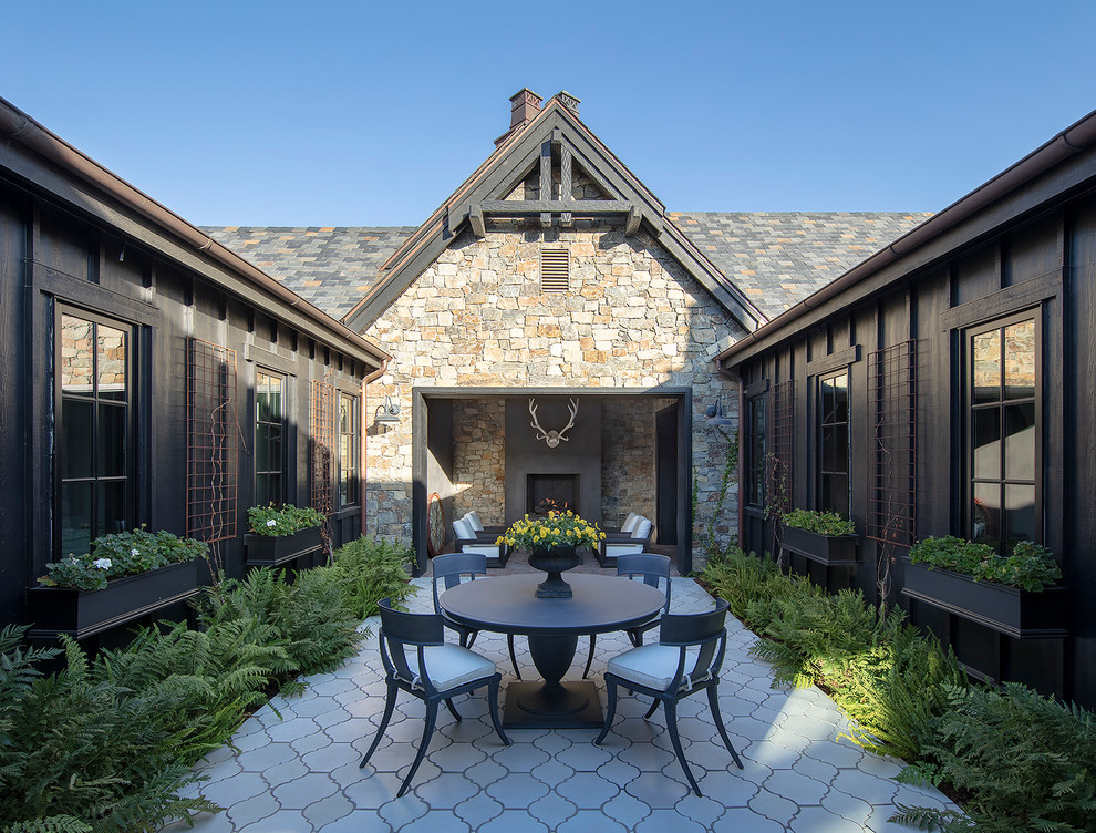 Inspiration for a rustic courtyard tile patio remodel in San Francisco with no cover