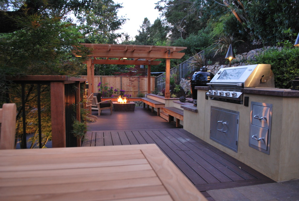 Design ideas for a medium sized mediterranean back patio in San Francisco with an outdoor kitchen, decking and a pergola.