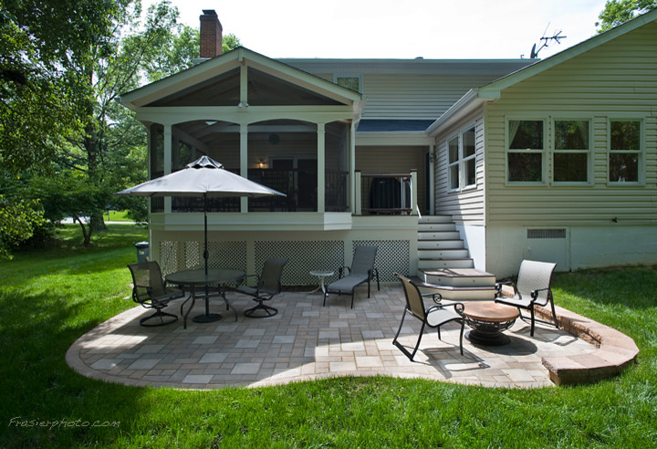 Photo of a medium sized traditional back patio in DC Metro with concrete paving.