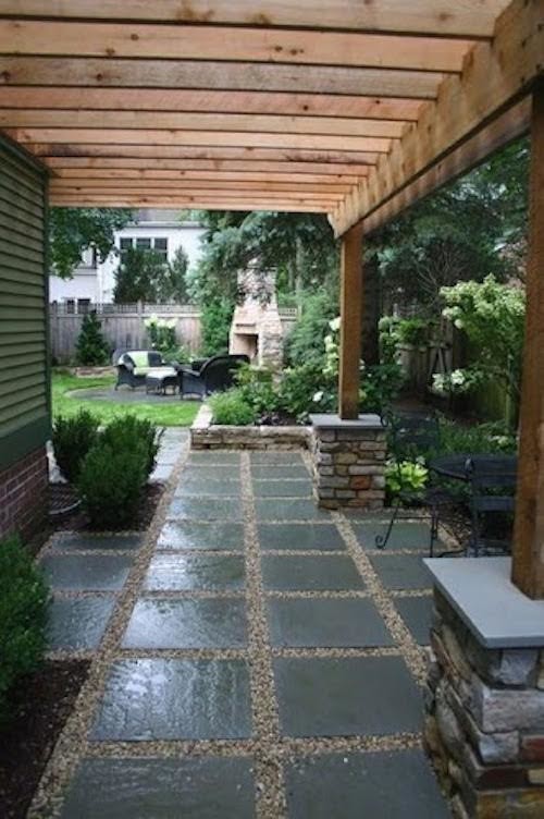 Patio - large traditional backyard concrete paver patio idea in Seattle with a pergola