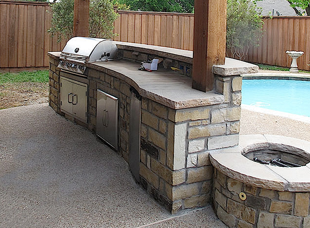 Mid-sized transitional backyard concrete patio kitchen photo in Portland with a roof extension