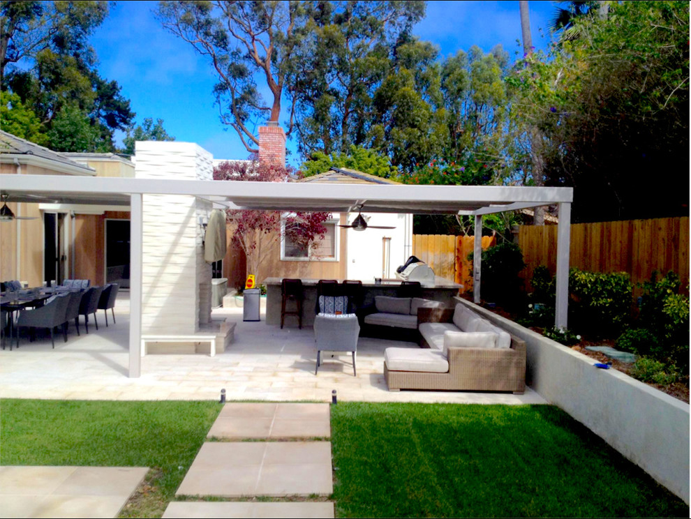 Patio kitchen - large contemporary backyard concrete paver patio kitchen idea in San Diego with a pergola