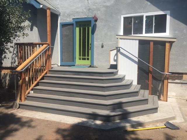 Inspiration for a mid-sized transitional backyard patio remodel in San Francisco with decking and no cover