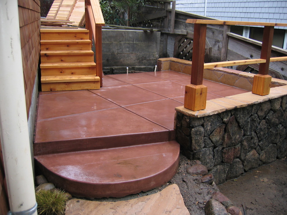 Inspiration for a mid-sized side yard stamped concrete patio remodel in San Francisco with no cover