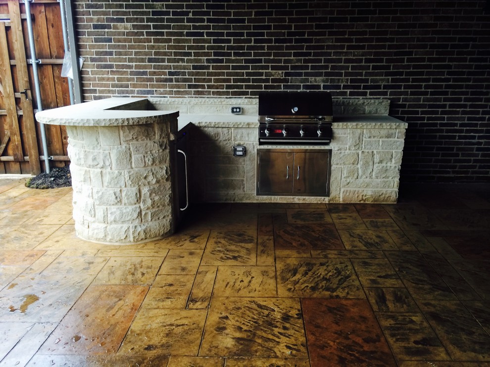 Photo of a medium sized traditional back patio in Dallas with an outdoor kitchen and tiled flooring.