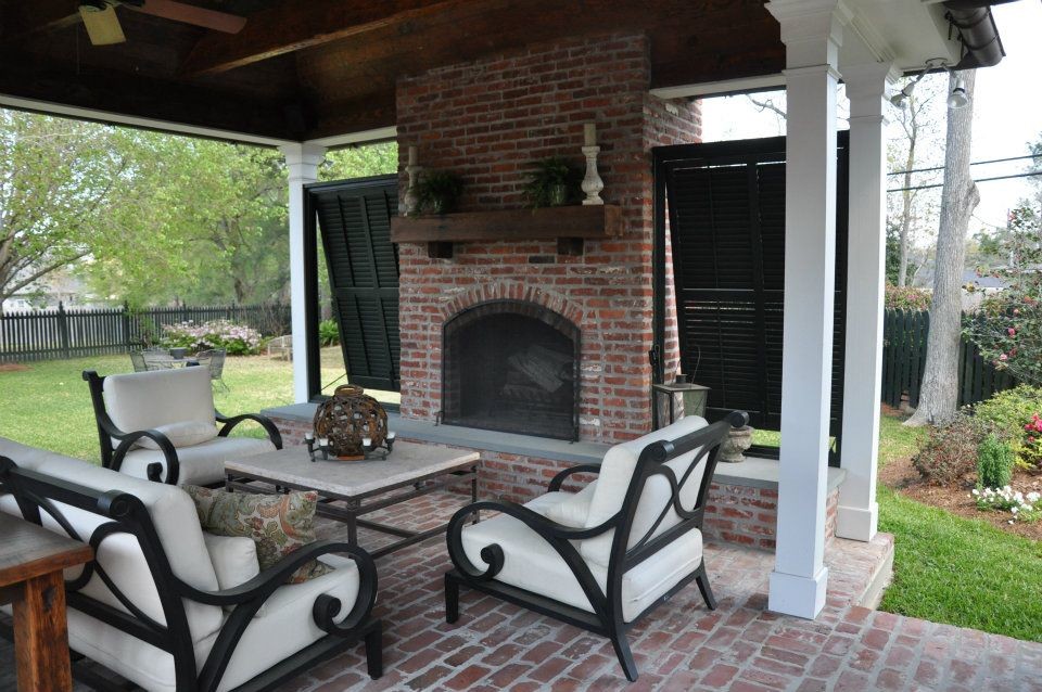 Inspiration for a large timeless backyard brick patio remodel in New Orleans with a gazebo and a fire pit