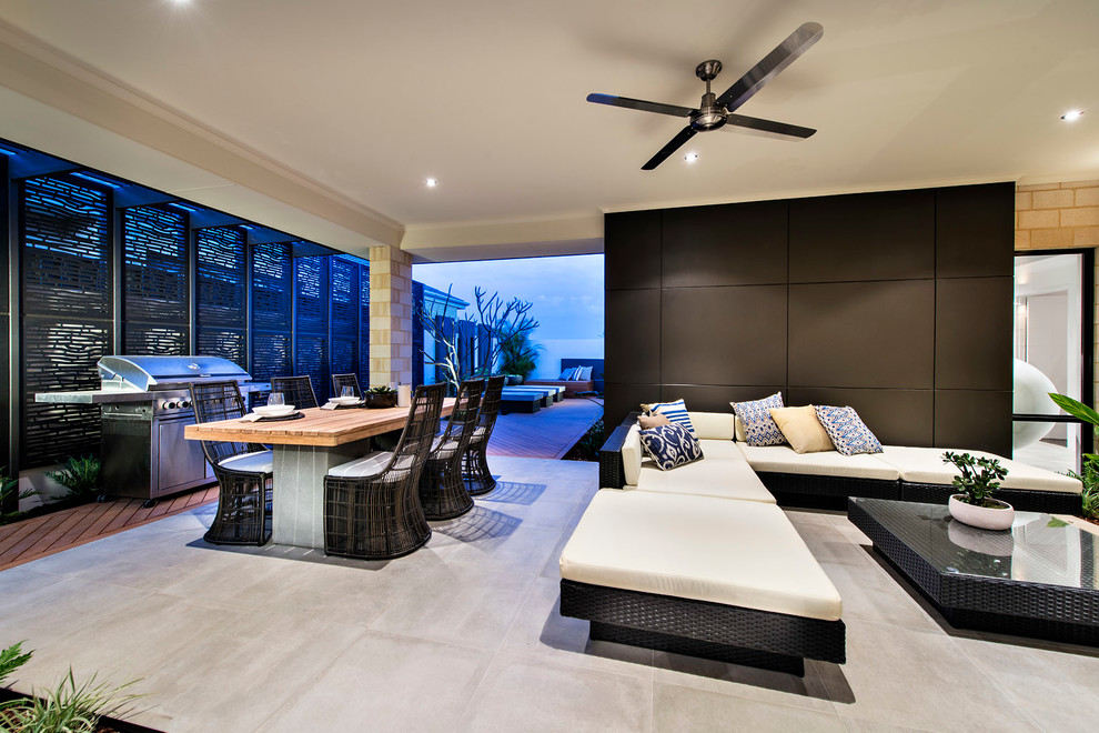 This is an example of a contemporary patio in Perth with concrete slabs, a roof extension and a bbq area.