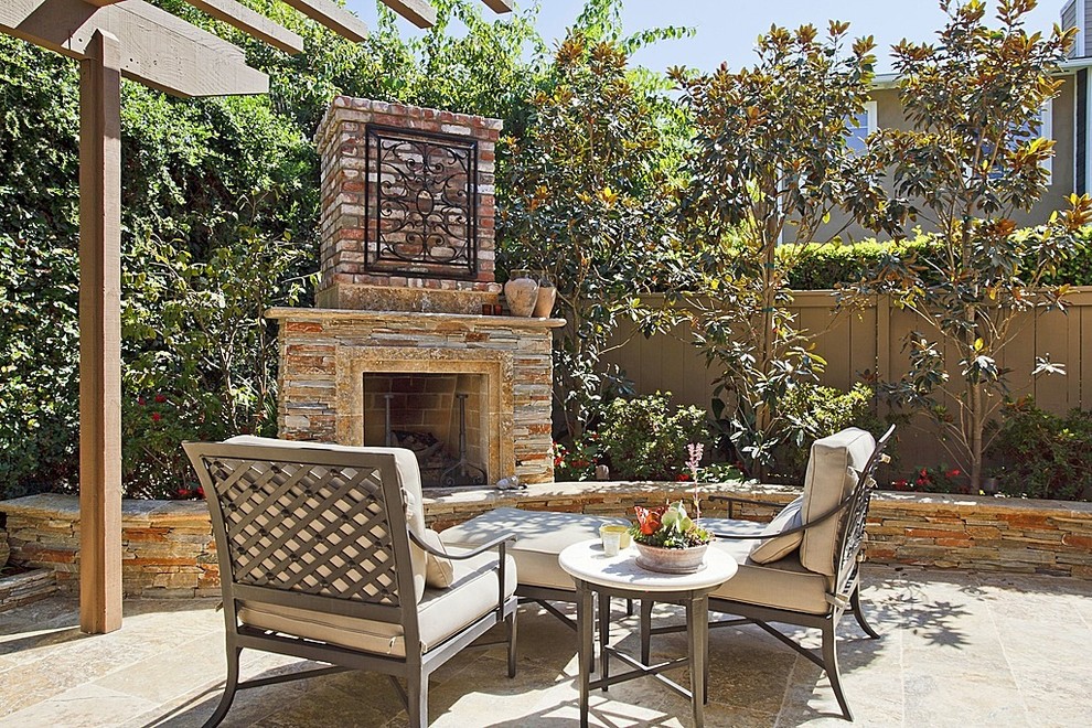 Inspiration for a medium sized traditional back patio in Los Angeles with an outdoor kitchen, no cover and natural stone paving.