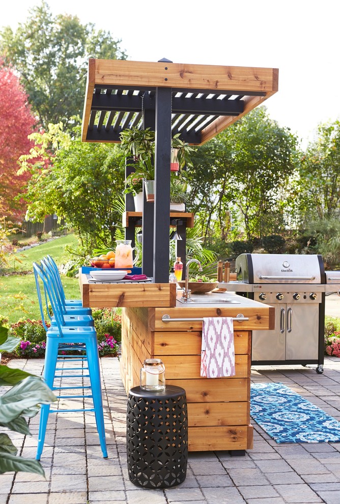 Example of a trendy backyard patio design in Other