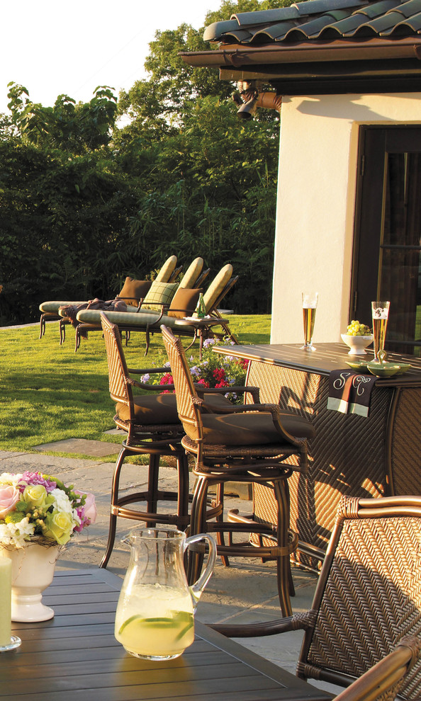 Outdoor bar stools and chaise lounges in resin wicker Traditional