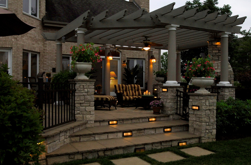 Photo of a large contemporary back patio in Chicago with an outdoor kitchen, concrete paving and a pergola.