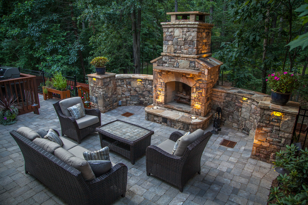 Inspiration for a medium sized traditional back patio in Atlanta with a fire feature, brick paving and no cover.