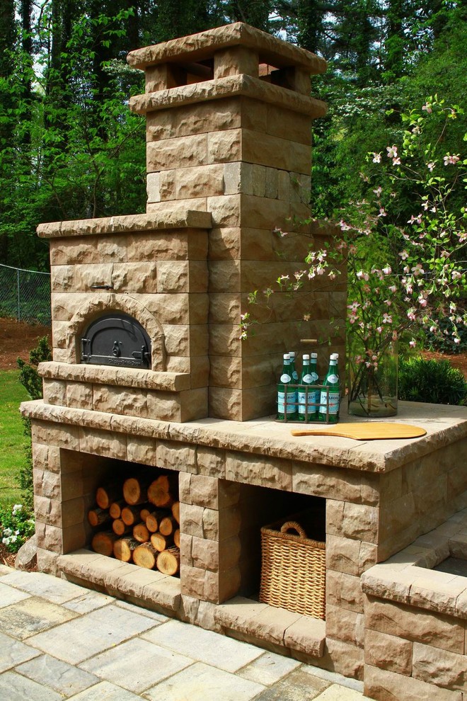 Medium sized rustic back patio in Atlanta with an outdoor kitchen, brick paving and no cover.