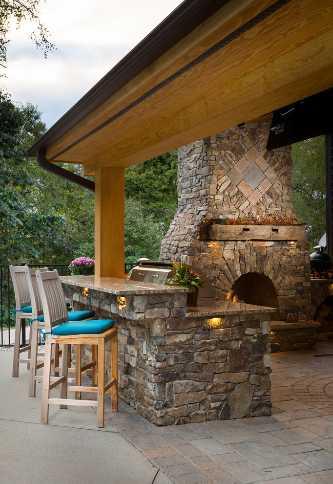 Inspiration for a rustic backyard brick patio remodel in Raleigh with a pergola