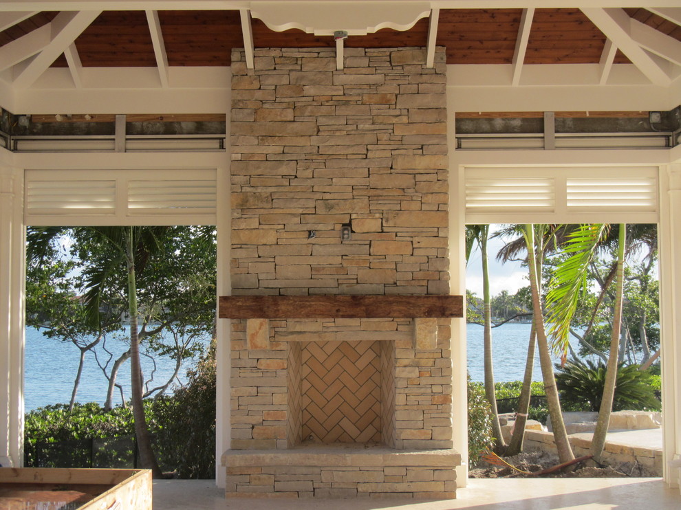 Outdoor fireplace wood mantel Contemporary Patio Miami by