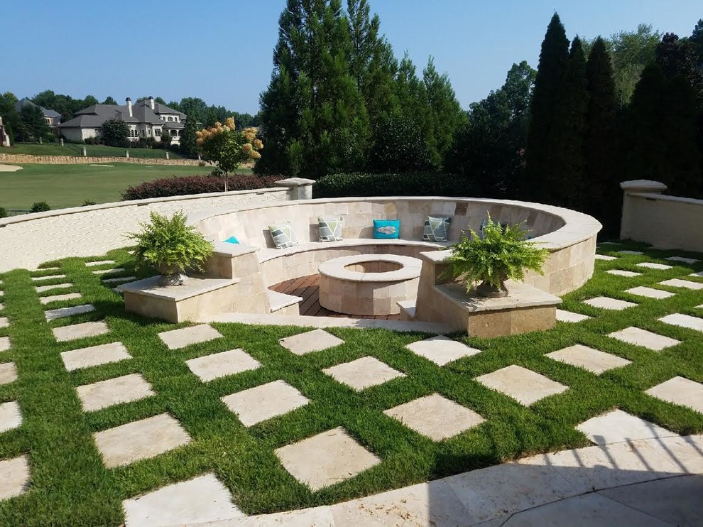 Inspiration for a large contemporary backyard concrete paver patio remodel in Charlotte with a fire pit and no cover