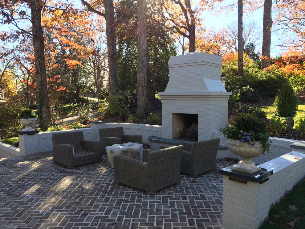 Inspiration for a mid-sized timeless backyard brick patio remodel in Richmond with a fire pit and no cover