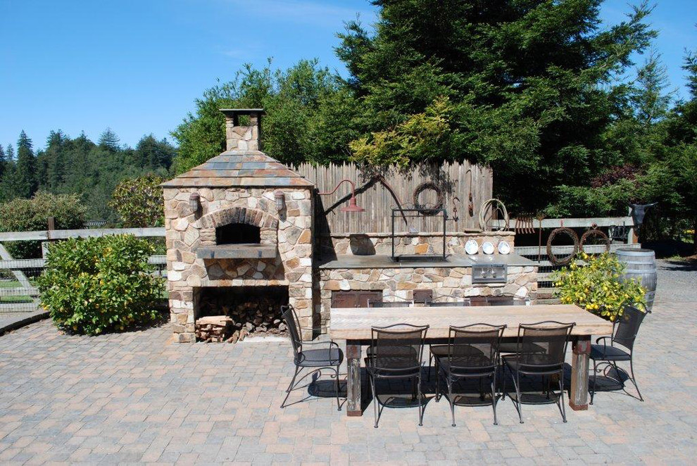 Inspiration for a classic patio in San Francisco with a fire feature, concrete paving and no cover.