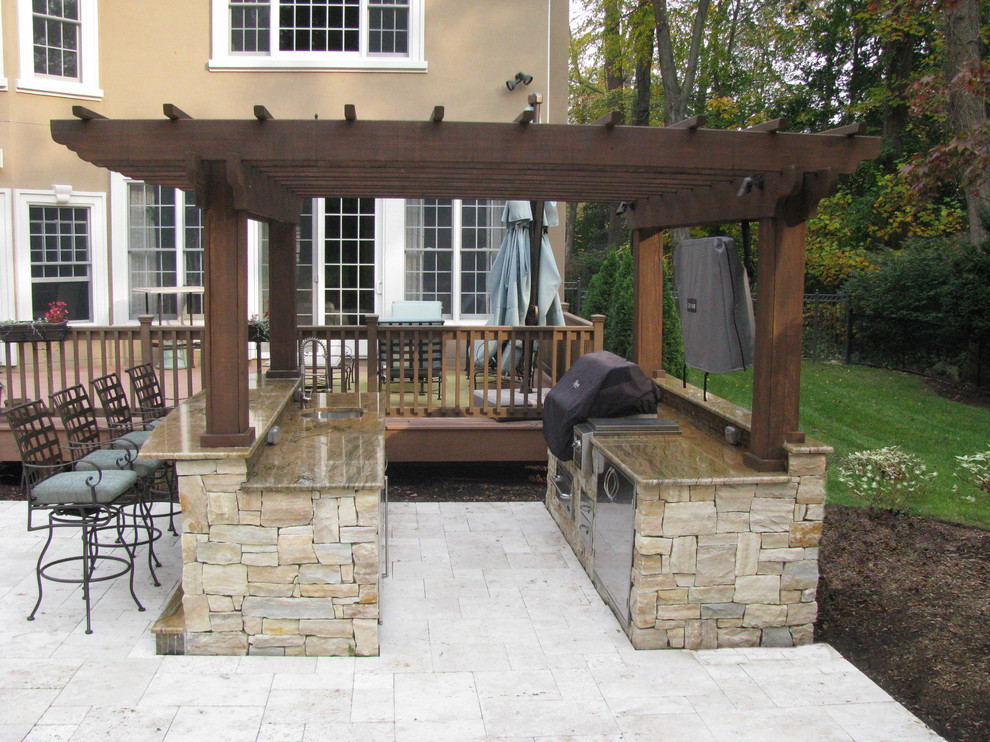 Medium sized modern back patio in Other with an outdoor kitchen.