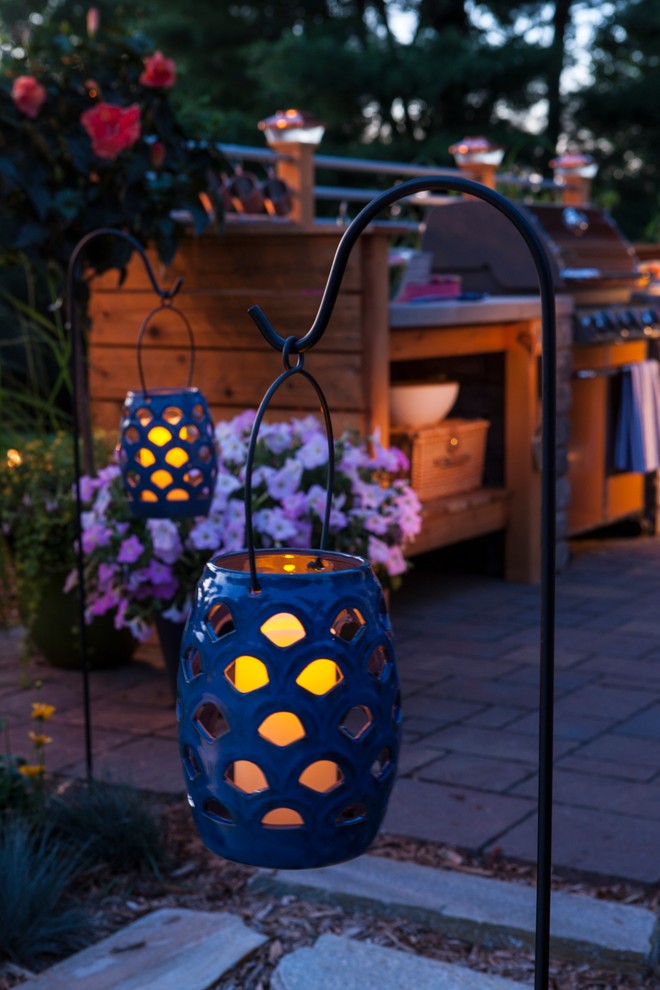 Small urban backyard brick patio kitchen photo in Other