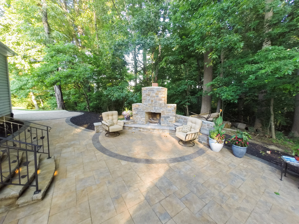 Patio - transitional backyard concrete paver patio idea in DC Metro with a fire pit