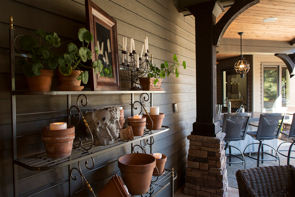 This is an example of a large classic back patio in Portland with an outdoor kitchen and concrete slabs.