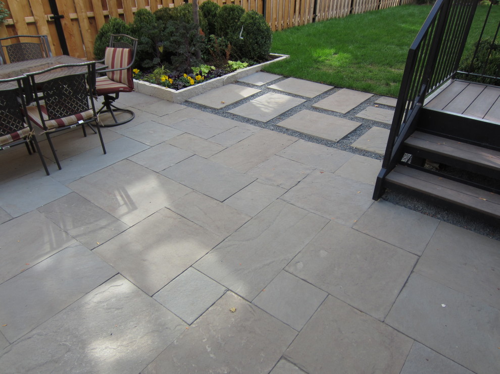 Design ideas for a medium sized classic back patio in Chicago with stamped concrete and no cover.