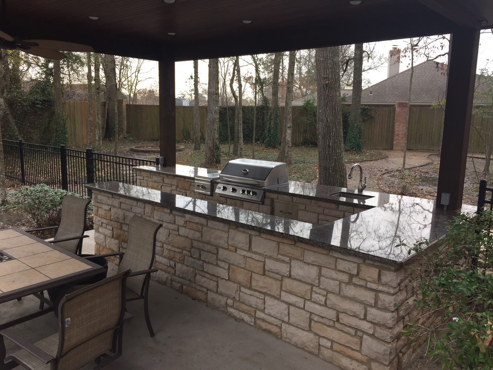 Design ideas for a medium sized classic back patio in Austin with an outdoor kitchen, concrete slabs and a gazebo.