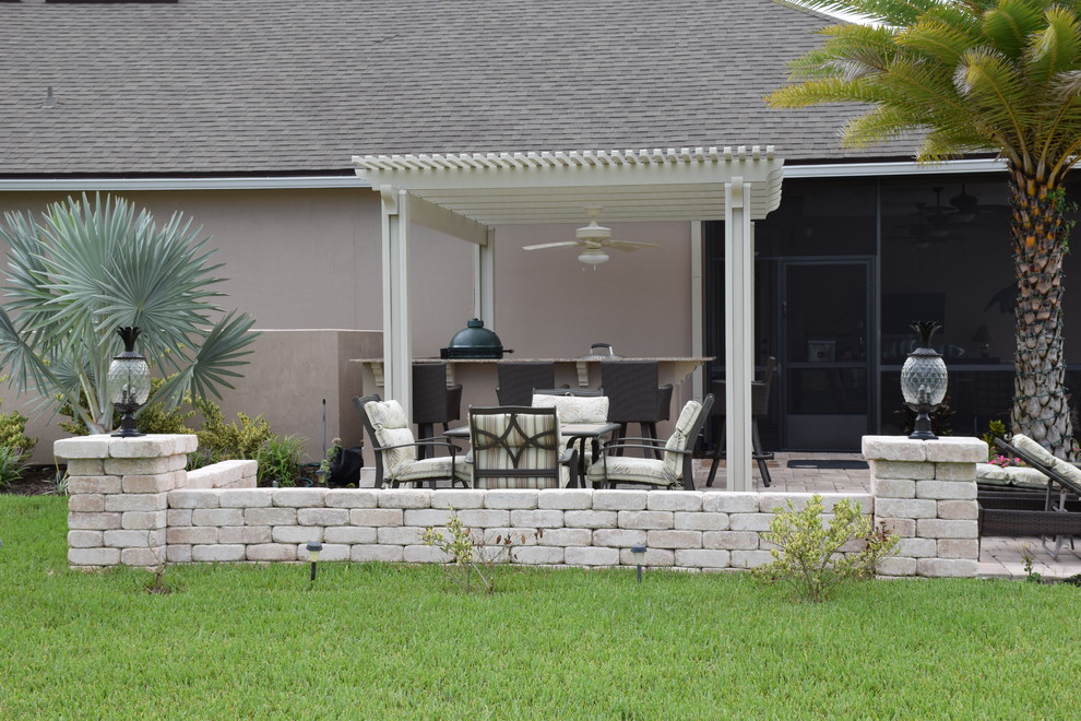 Outdoor Kitchen with pergola, knee wall, Big Green Egg and Evo