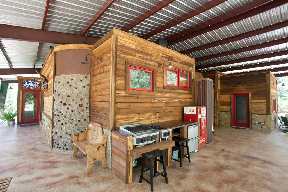 Example of a mountain style patio kitchen design in Dallas