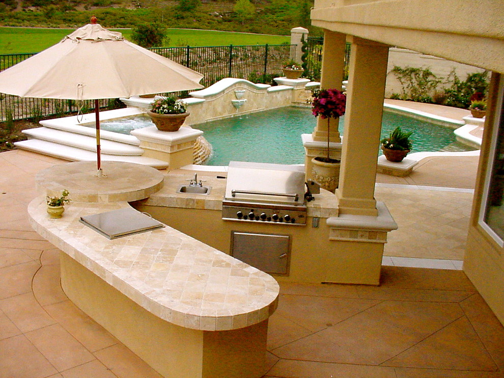 Inspiration for a tropical patio remodel in Orange County