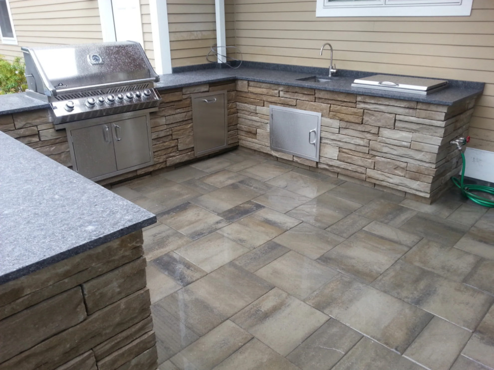 Inspiration for a medium sized traditional patio in Bridgeport with an outdoor kitchen, natural stone paving and no cover.