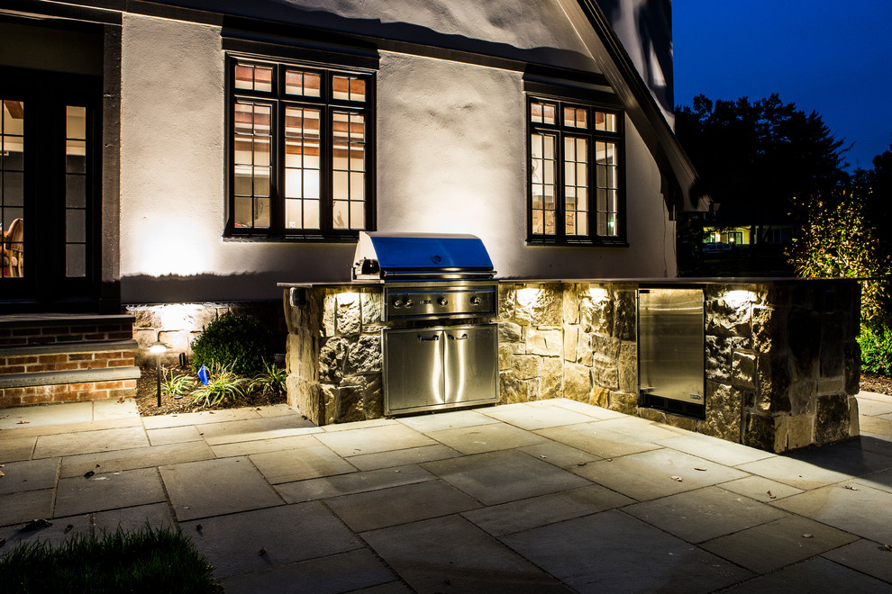 Mid-sized elegant backyard concrete paver patio kitchen photo in New York with no cover