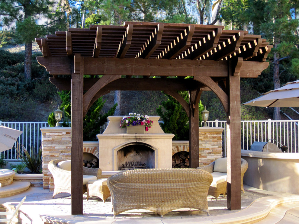 Patio - mid-sized traditional backyard stamped concrete patio idea in Dallas with a fire pit and a pergola