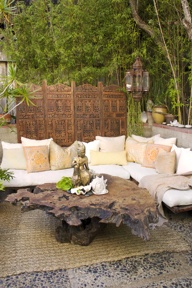 Patio - small eclectic courtyard patio idea in Orange County