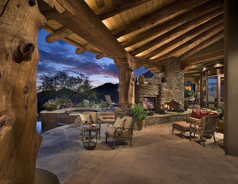 Example of a southwest patio design in Phoenix with a fire pit