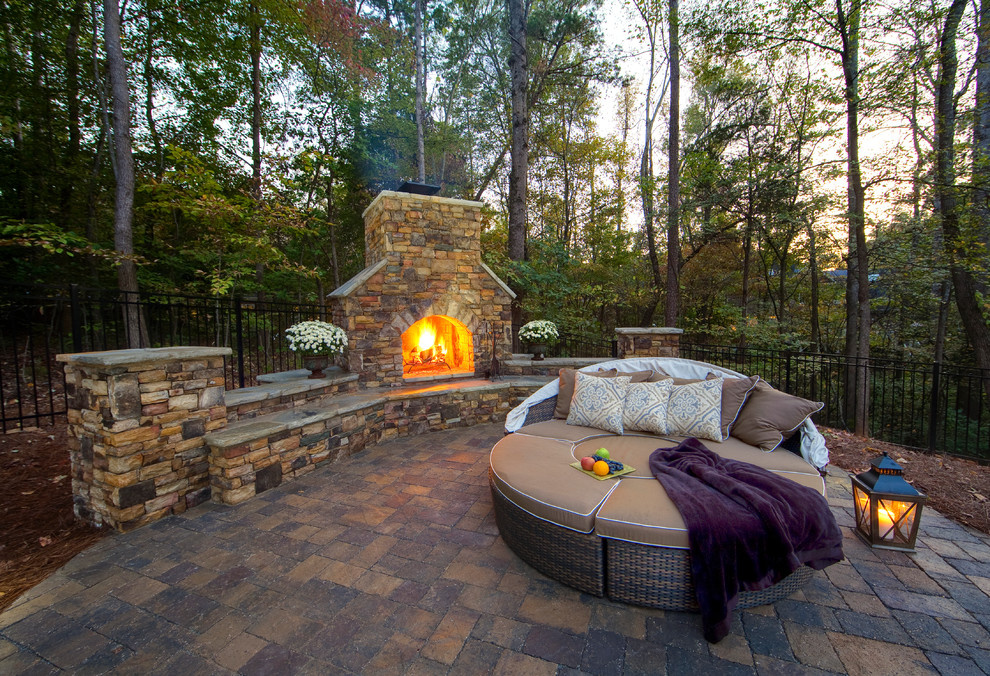 Patio - traditional backyard patio idea in Charlotte with a fire pit