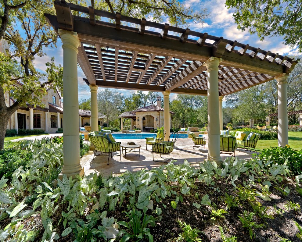 This is an example of a mediterranean patio in Dallas with a gazebo.