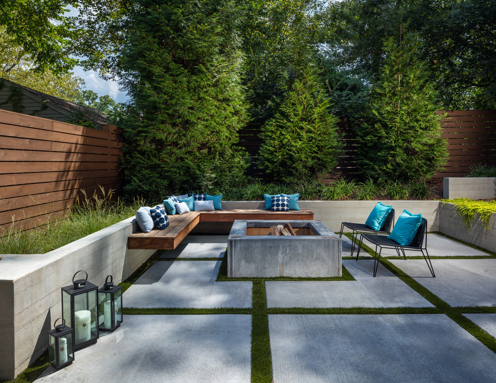 Patio - large contemporary backyard concrete patio idea in Atlanta with a fire pit and no cover