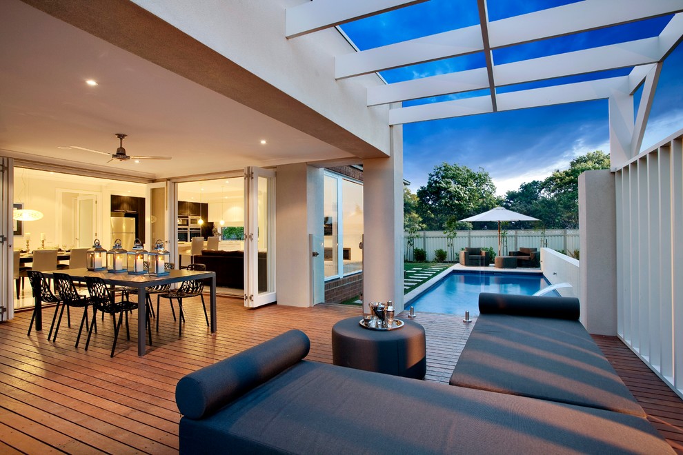 Contemporary patio in Melbourne with a pergola, a water feature and decking.