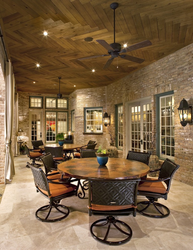 Example of a classic patio design in Dallas with a roof extension