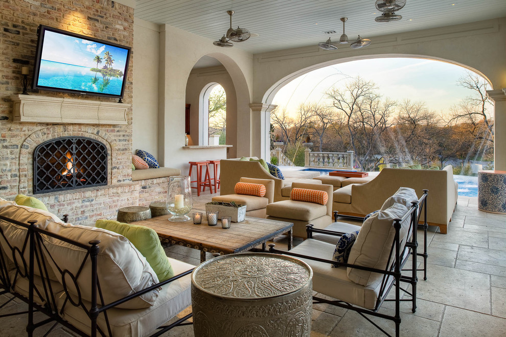 Inspiration for a mediterranean patio remodel in Dallas with a fire pit